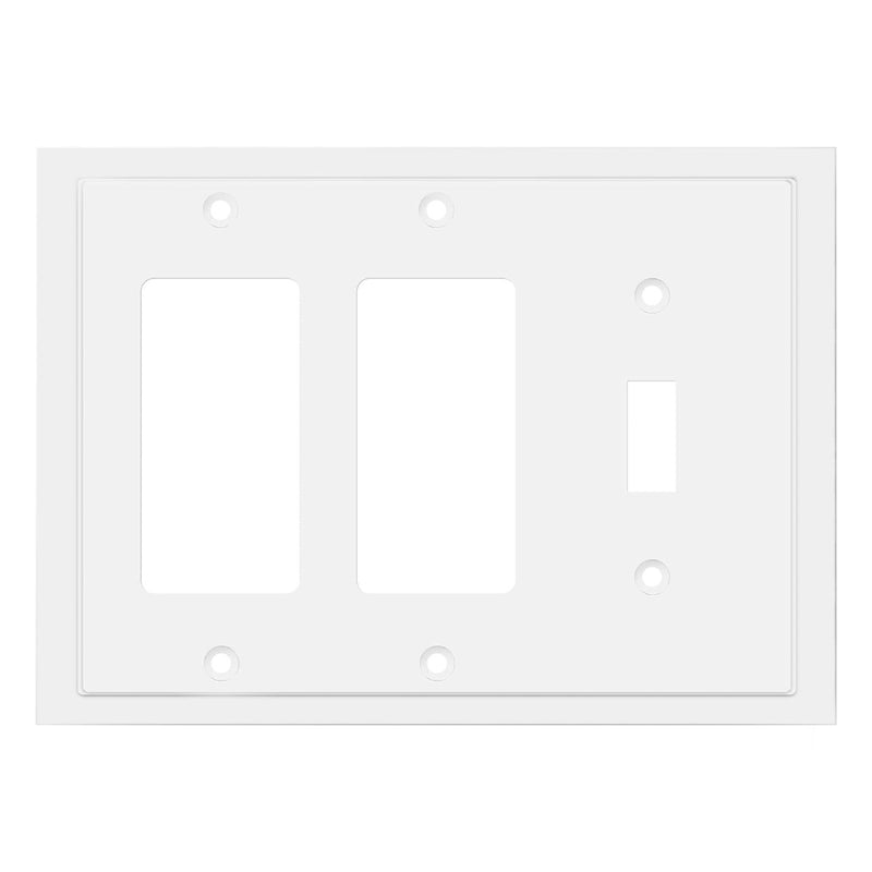 White wall plate with three switch sockets on a white background