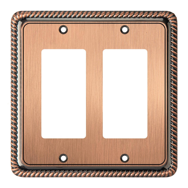 Copper double gang switch plate with decorative border on a white background