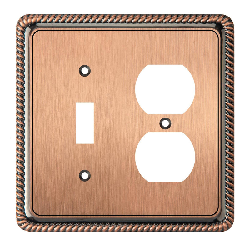 Copper switch plate with a single toggle and double outlet design on a white background
