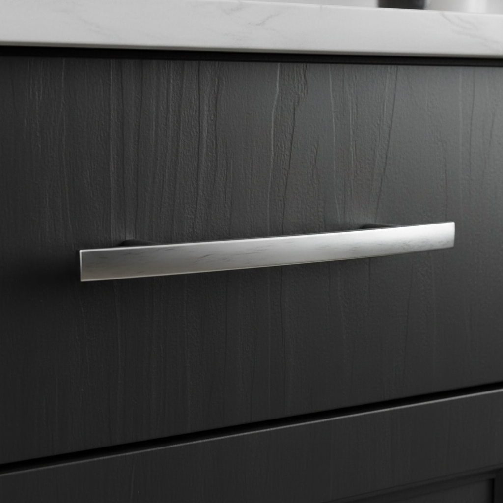 Close-up of a dark wooden drawer with a chrome handle