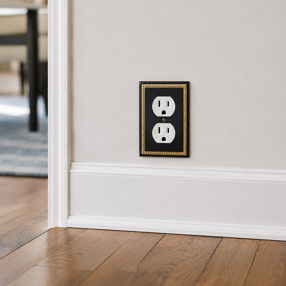 Harmon Black and Brushed Gold Single Duplex Decorative Outlet Cover