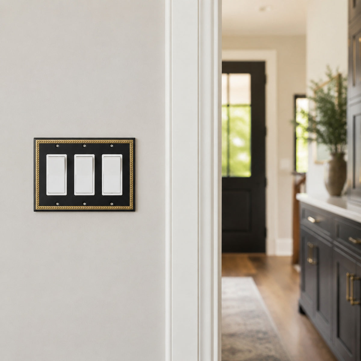 Harmon Black and Brushed Gold Triple Decora Decorative Switchplate Cover