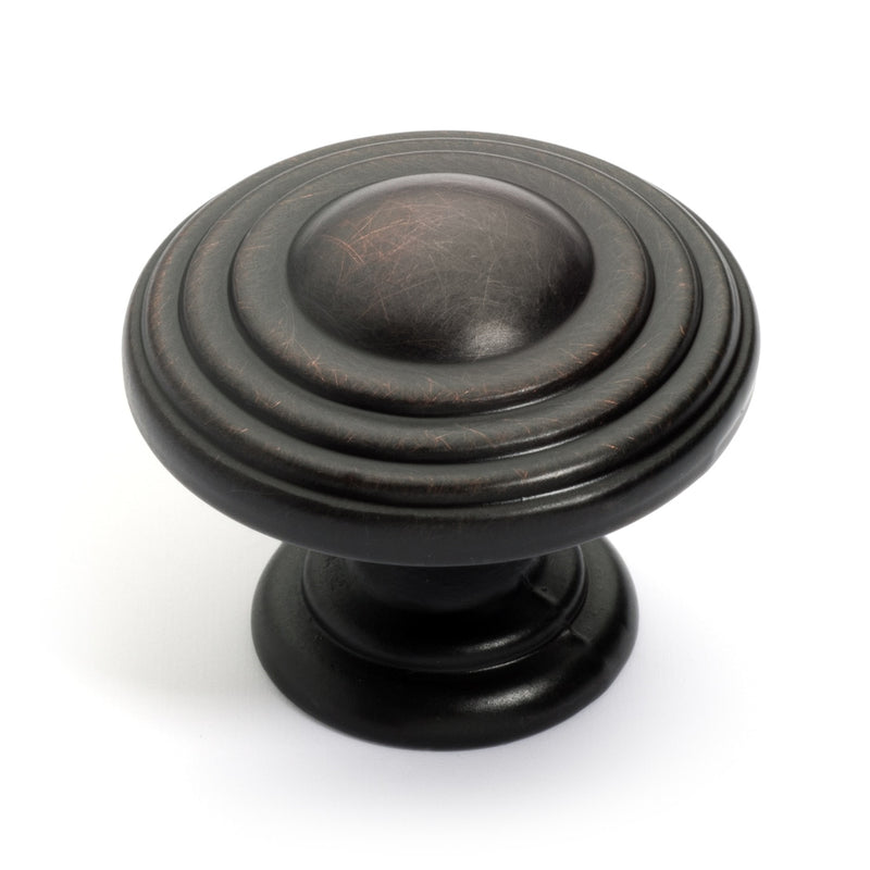 Oil rubbed bronze cabinet knob with stacking rings and raised round at the center