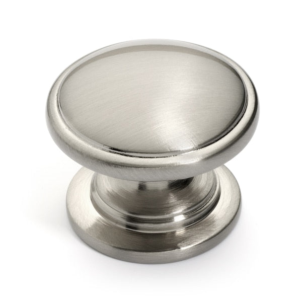 Round drawer knob in satin nickel finish with one and a quarter inch diameter