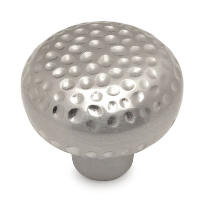 Golf ball texture round drawer knob in satin nickel finish with one and a quarter inch diameter