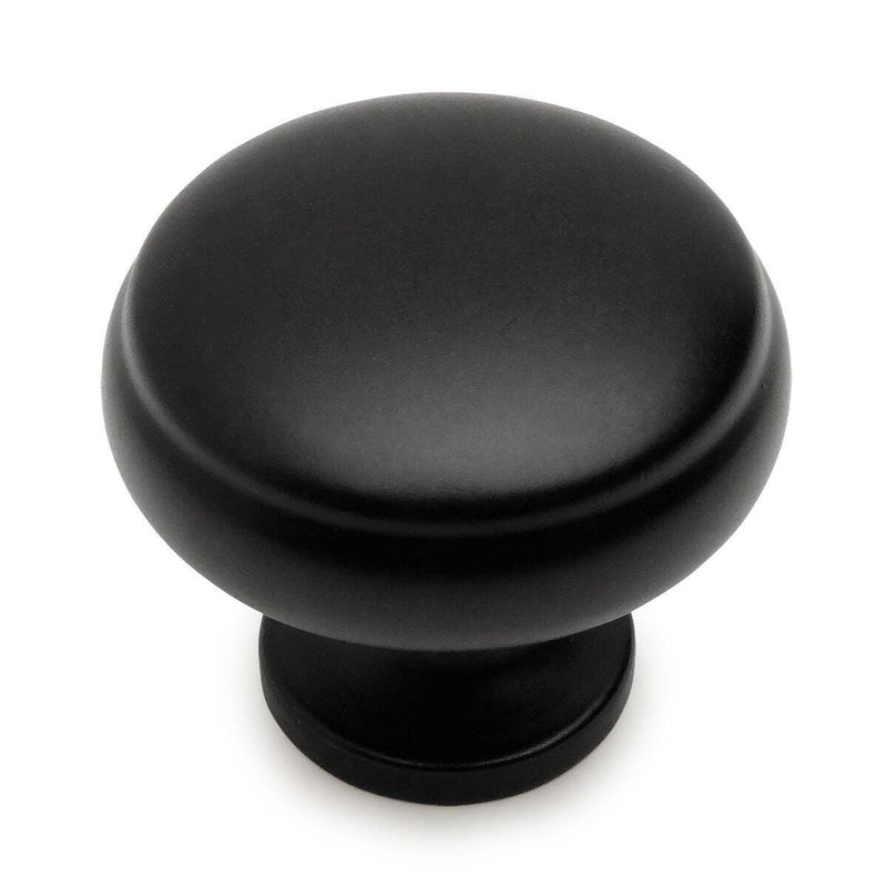 Round flat black cabinet knob with subtle beveled lip design and one and three sixteenths inch diameter