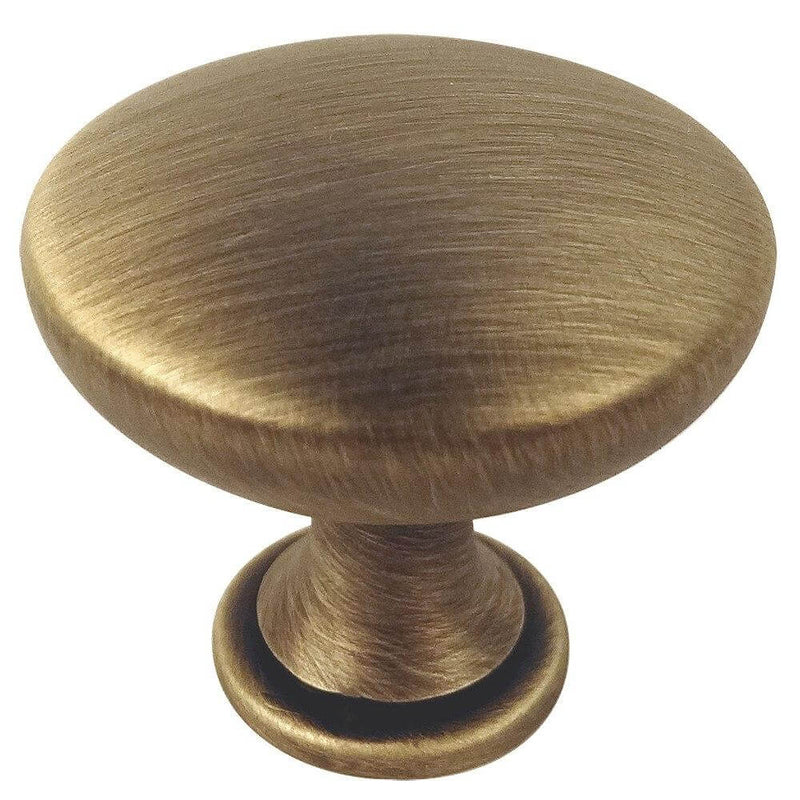 Brushed antique brass round cabinet drawer knob with one and three sixteenths inch diameter