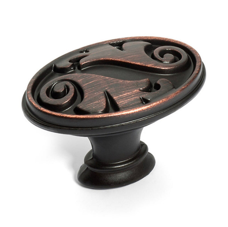 Dynasty flat oval drawer knob in oil rubbed bronze finish with leaves engraving on the face
