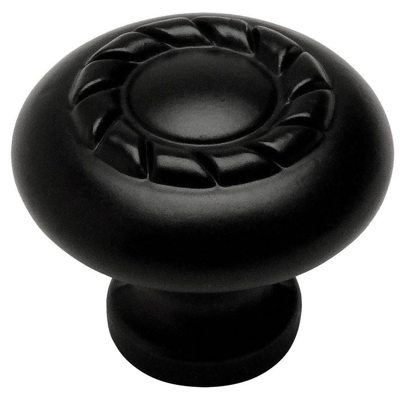 Round flat black cabinet knob with rope design on top and one and three eighteenths inch diameter