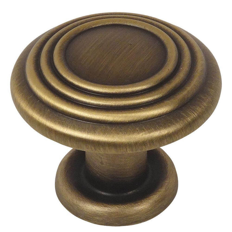 Brushed antique brass drawer knob with three raised rings on the face