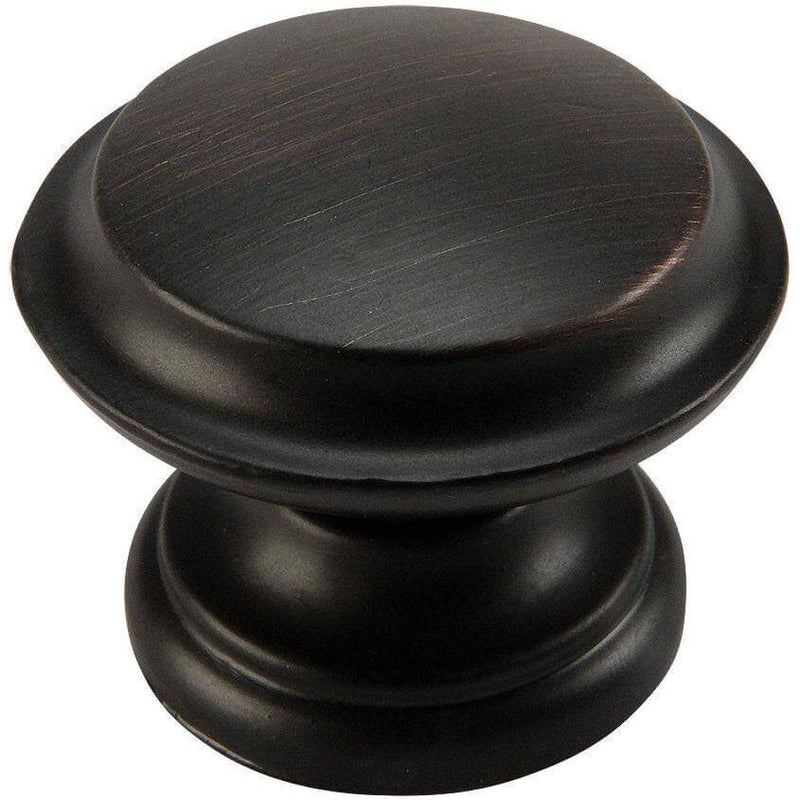 Oil rubbed bronze drawer knob with raised centre design and one and three eighths inch diameter