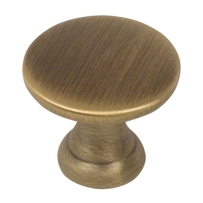 Round brushed antique brass drawer knob with flat top and seven and eights inch diameter