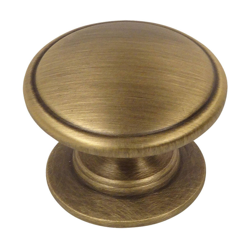 Brushed antique brass drawer knob with slightly raised centre