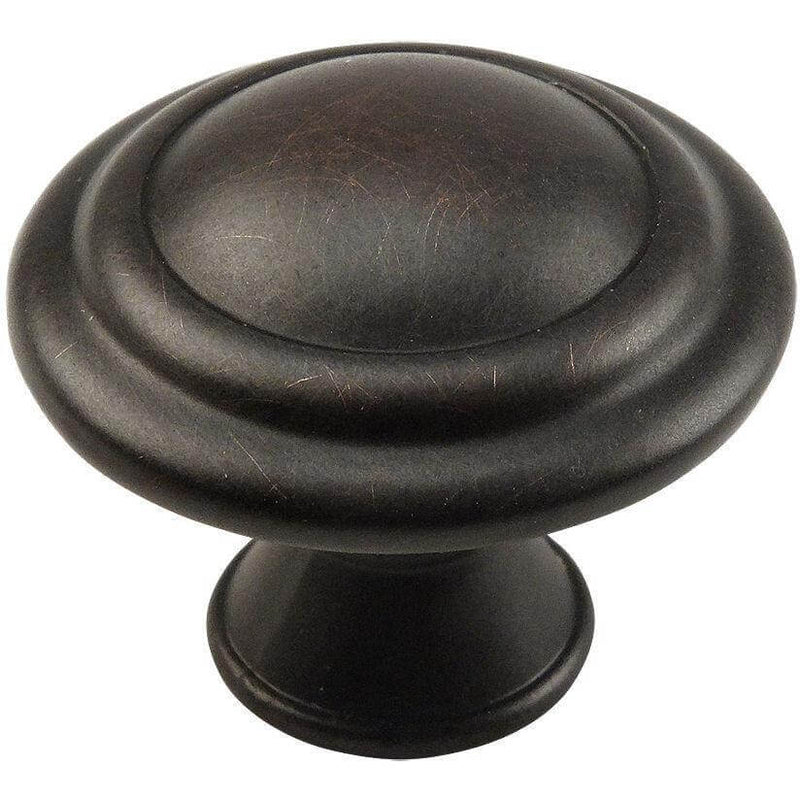 Disc shaped cabinet knob in oil rubbed bronze finish with one and an eighth inch diameter