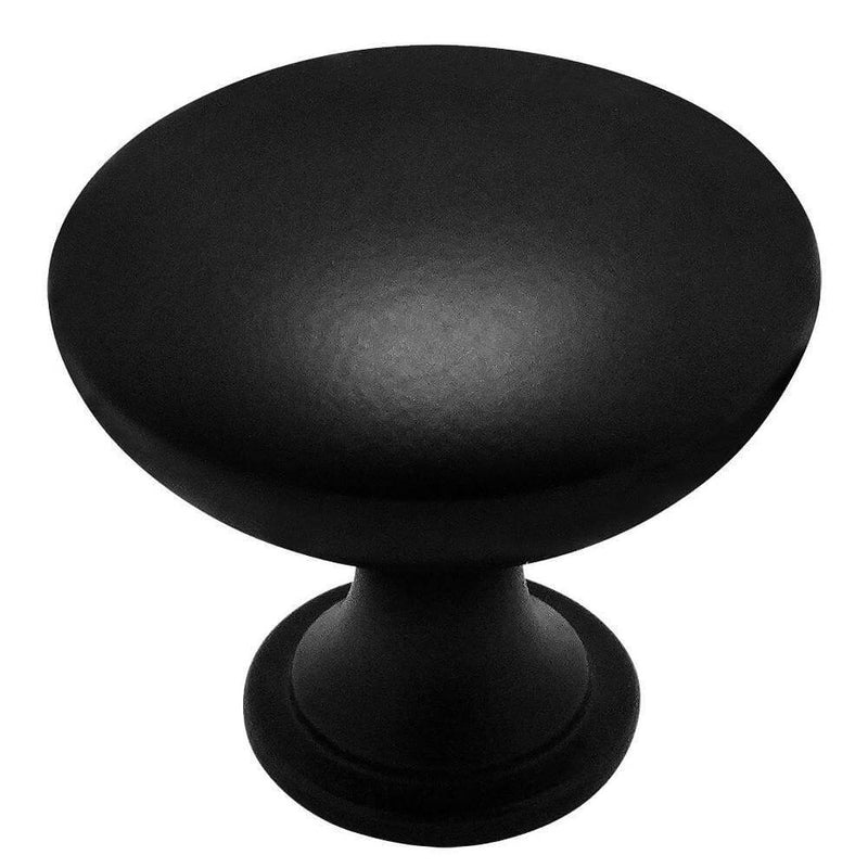 Cabinet drawer knob in flat black finish with round shape and one and three sixteenths inch diameter