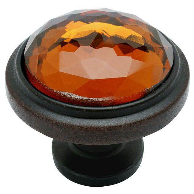 Round cabinet drawer knob in oil rubbed bronze finish with round glass at the centre and one and a quarter inch diameter