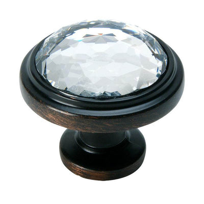 Oil rubbed bronze cabinet drawer knob with clear glass at the centre and one and a quarter inch diameter
