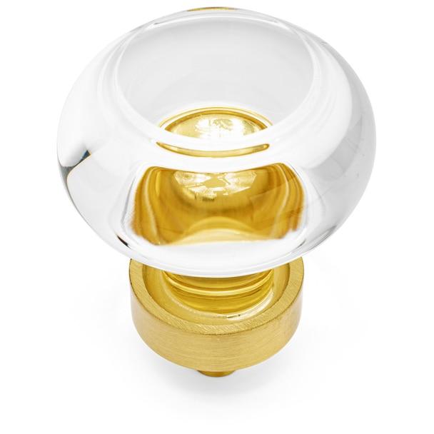 Clear glass cabinet knob in brushed brass finish with one and three eighths inch diameter