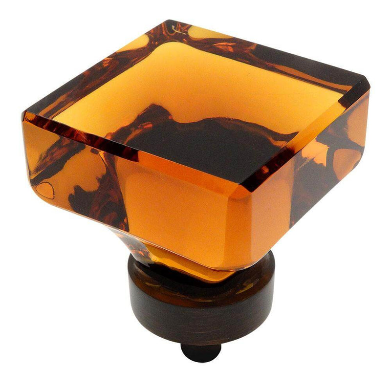 Oil rubbed bronze cabinet drawer knob with amber glass finish and one and three eighths inch diameter