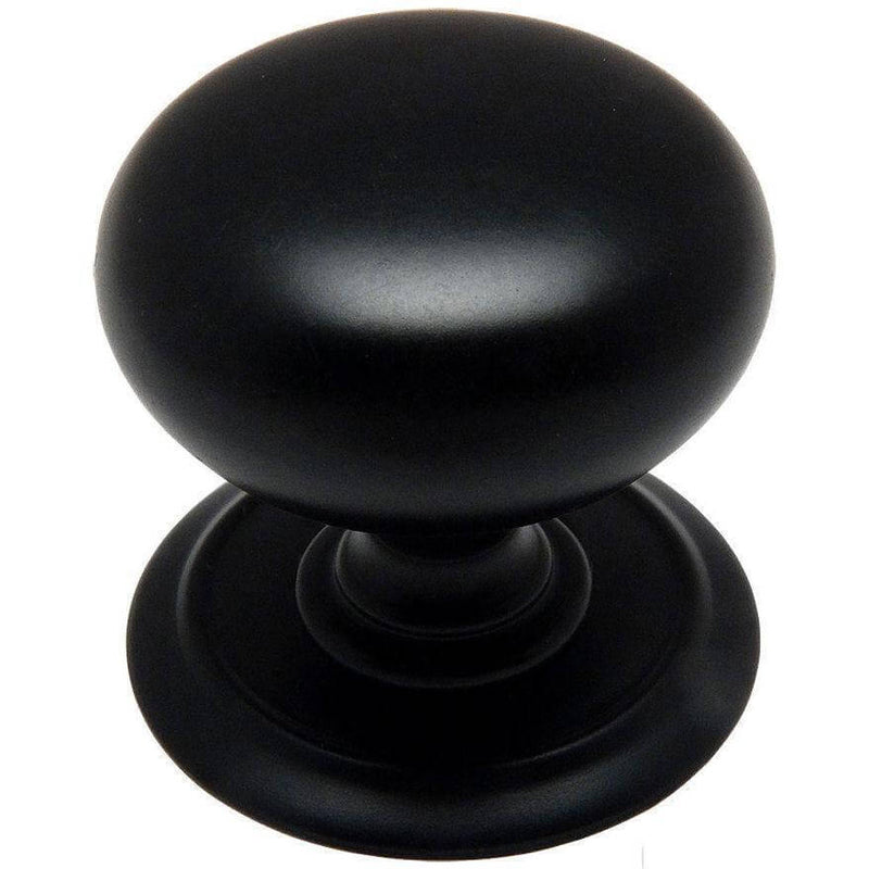 Round flat black knob with wide flat base and one and a quarter inch diameter