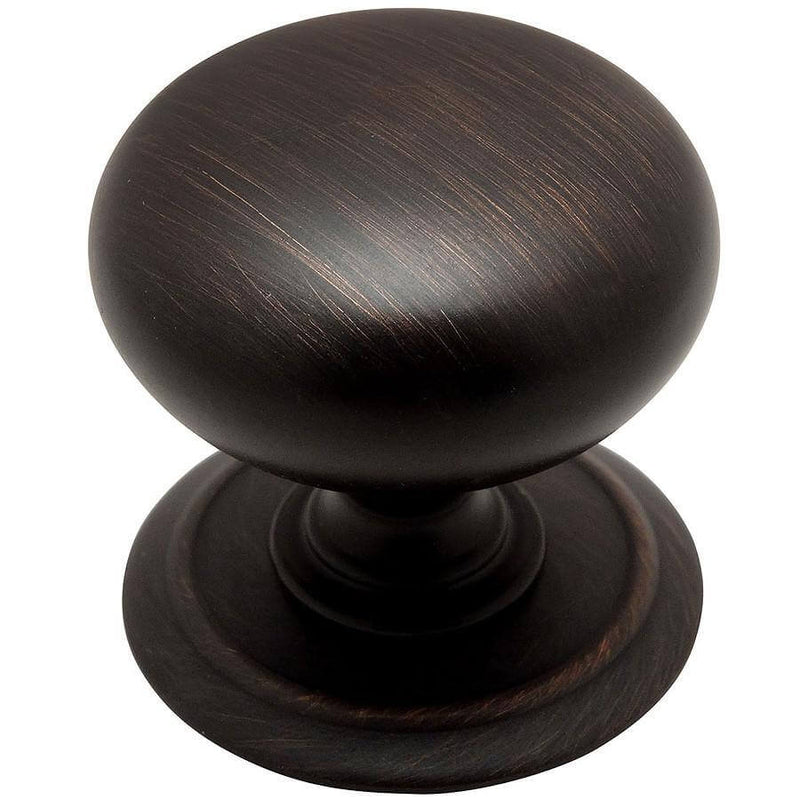 Round drawer knob in oil rubbed bronze with one and a quarter inch diameter