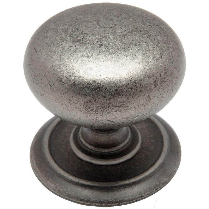 Round weathered nickel drawer knob with a ring embossed on backplate