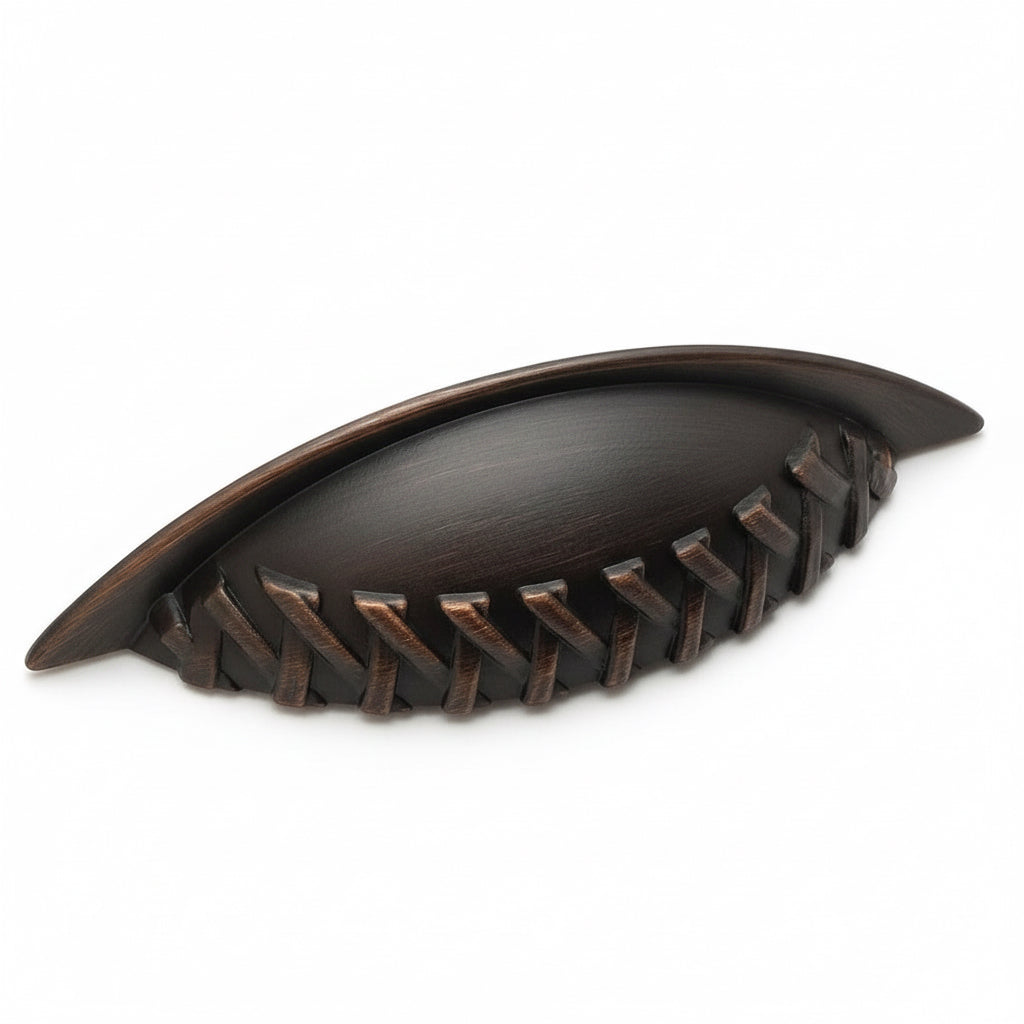 Three inch hole spacing cabinet cup pull in oil rubbed bronze with braid design at the edge