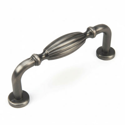 Antique silver cabinet drawer pull with three inch hole spacing and an engraved oval form in the middle 