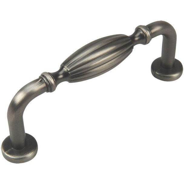 Antique silver cabinet drawer pull with three inch hole spacing and an engraved oval form in the middle 