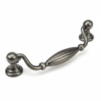 Antique silver cabinet pull with five inch hole spacing and an engraved slim oval form in the middle