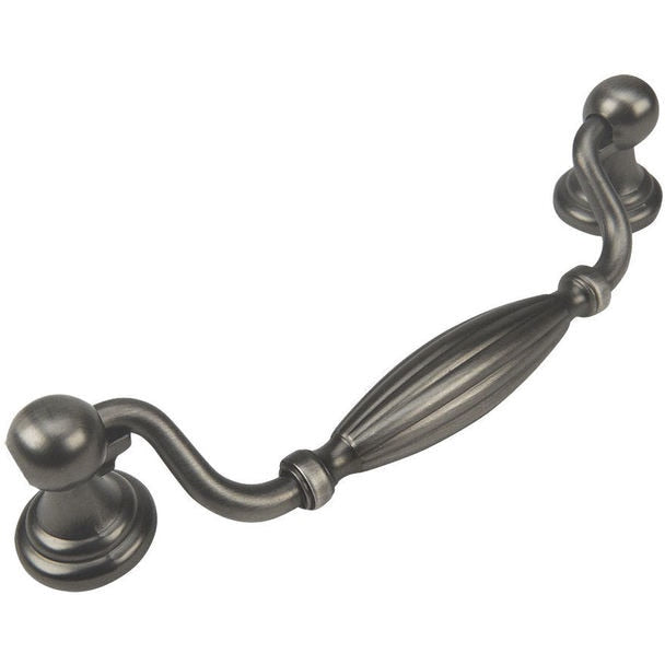 Antique silver cabinet pull with five inch hole spacing and an engraved slim oval form in the middle