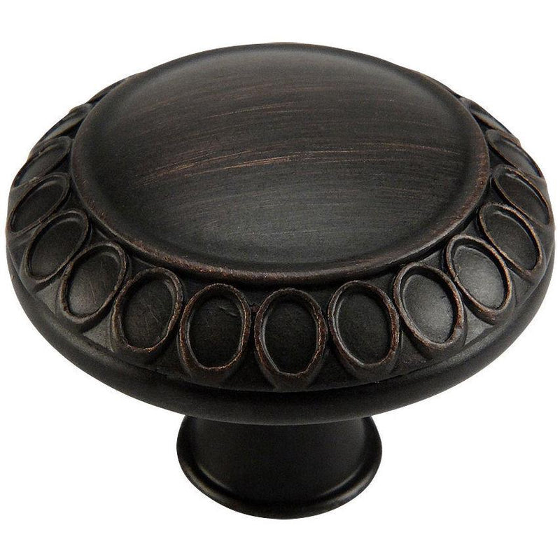 Round cabinet knob in oil rubbed bronze finish with rings carvings and one and five sixteenths inch diameter