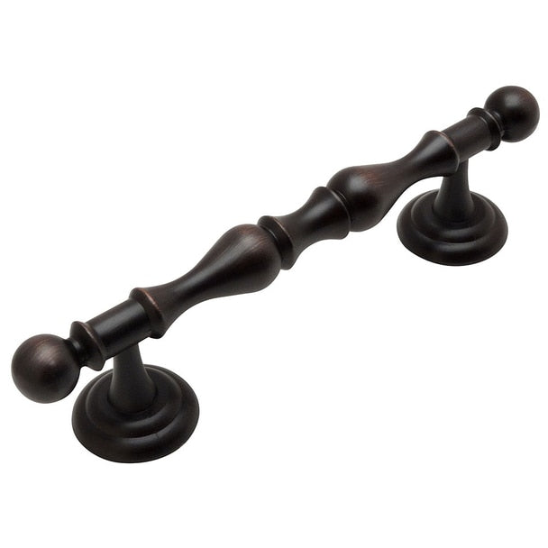 Four inch hole spacing cabinet drawer pull in oil rubbed bronze finish and wavy shaped handle