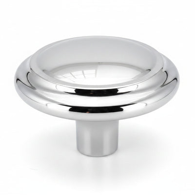 Round cabinet drawer knob with raised centre in polished chrome finish and one and a quarter inch diameter