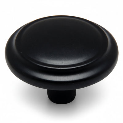 Round cabinet knob with raised centre and one and a quarter inch diameter