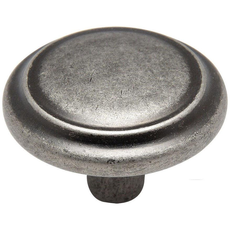 Weathered nickel drawer pull with raised centre design and one and a quarter inch diameter