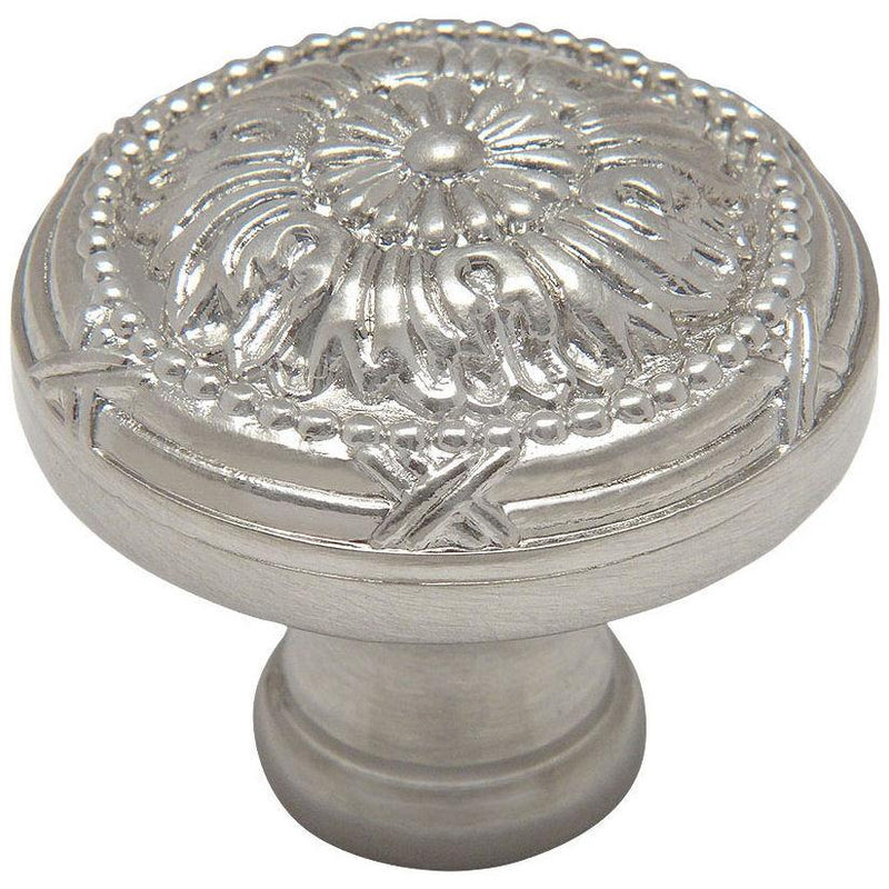 Round drawer knob in satin nickel finish with one and a quarter inch diameter