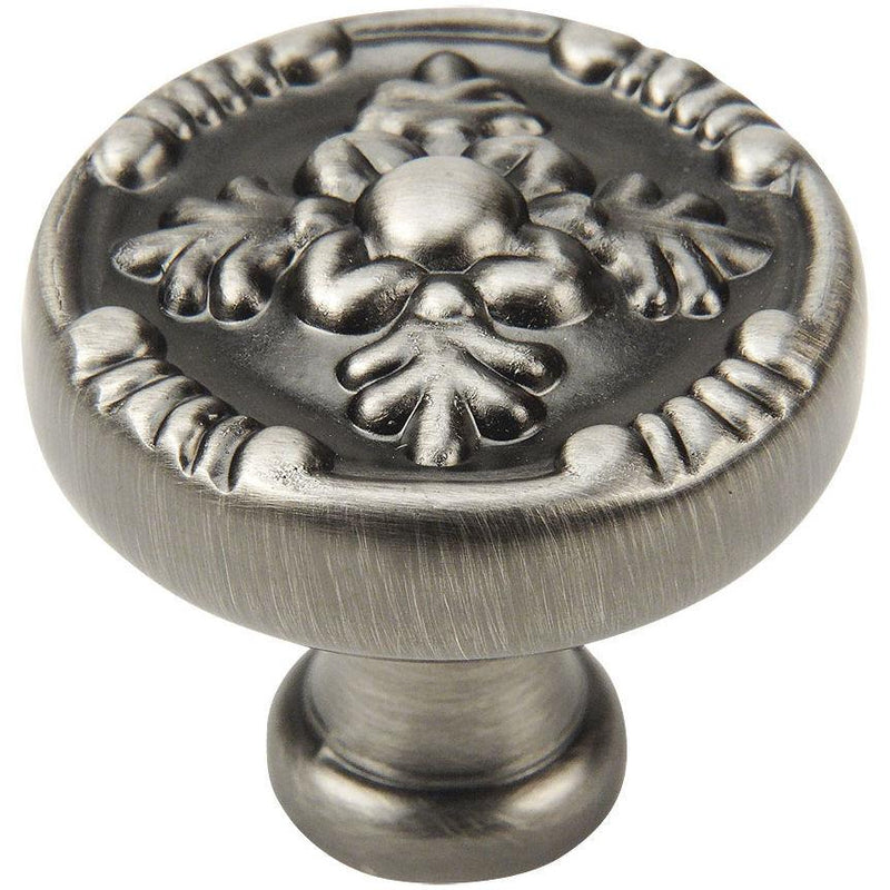 Round cabinet knob in antique silver finish with tree shaped engraving on the face