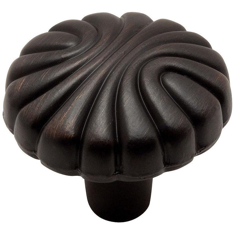 Round cabinet knob in oil rubbed bronze finish with half circle carvings