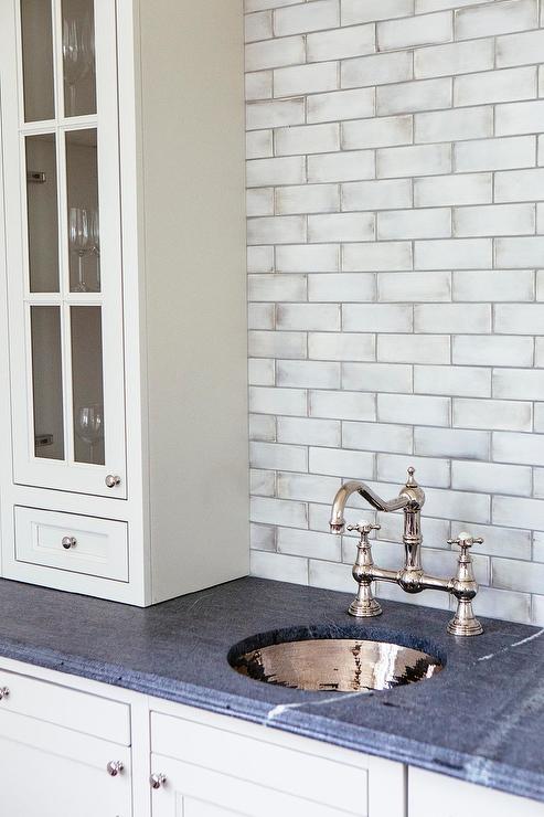 Cosmas 1438SN Satin Nickel Cabinet Knob on White bar with subway backsplash