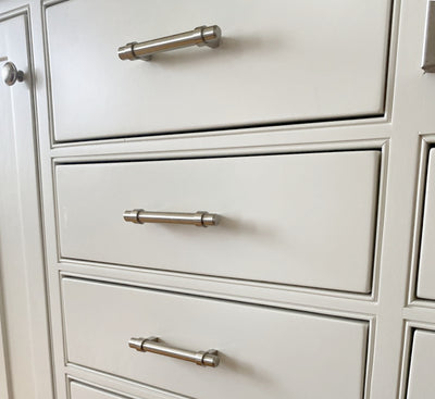 Cosmas 161-96SN Satin Nickel Euro Style Bar Pulls on beige kitchen drawers