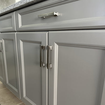 Cosmas 702-4SN Satin Nickel Cabinet Pull on gray cabinets