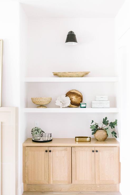 Cosmas 5560ORB knobs on a wood cabinet