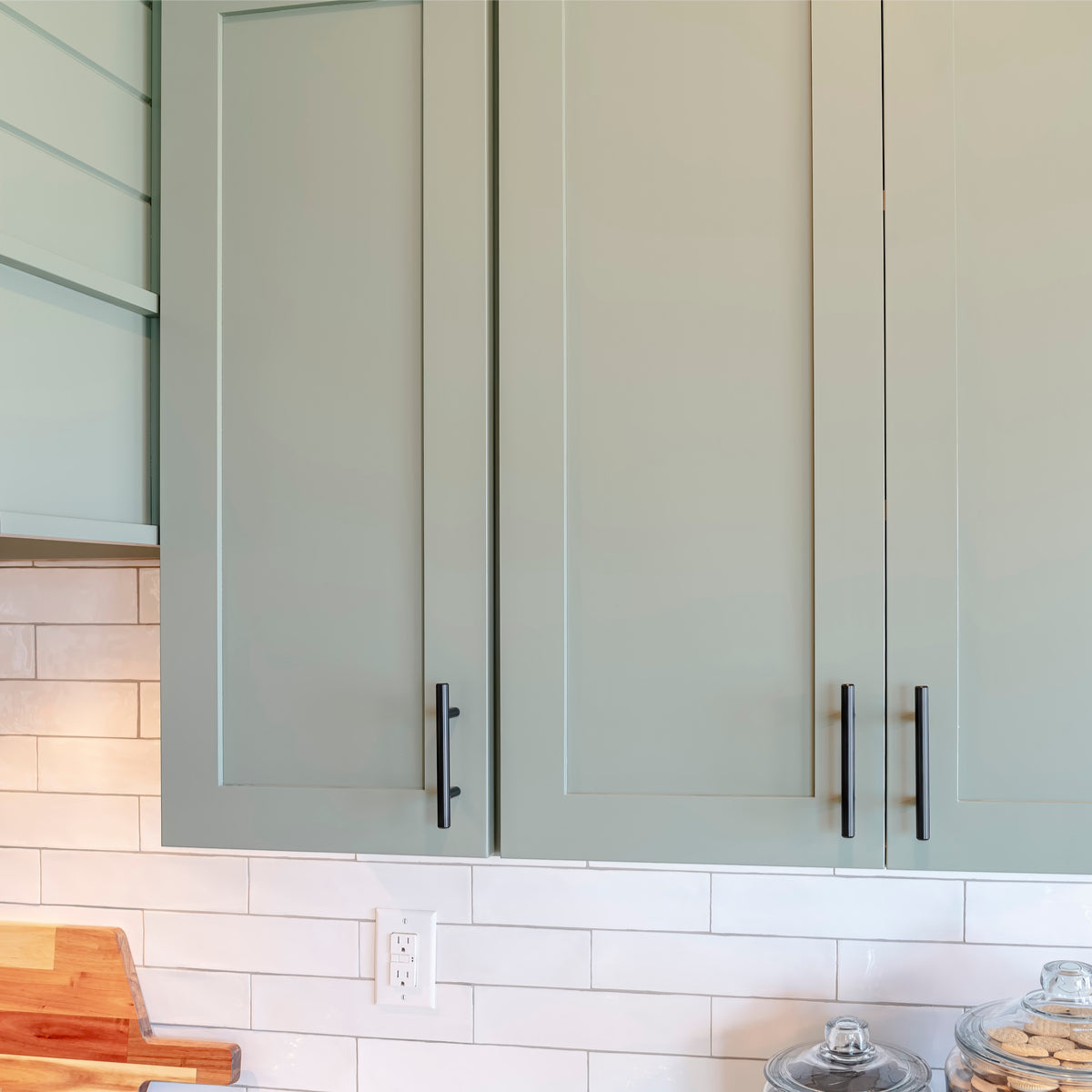 Cosmas 305-030FB on seafoam green cabinet doors