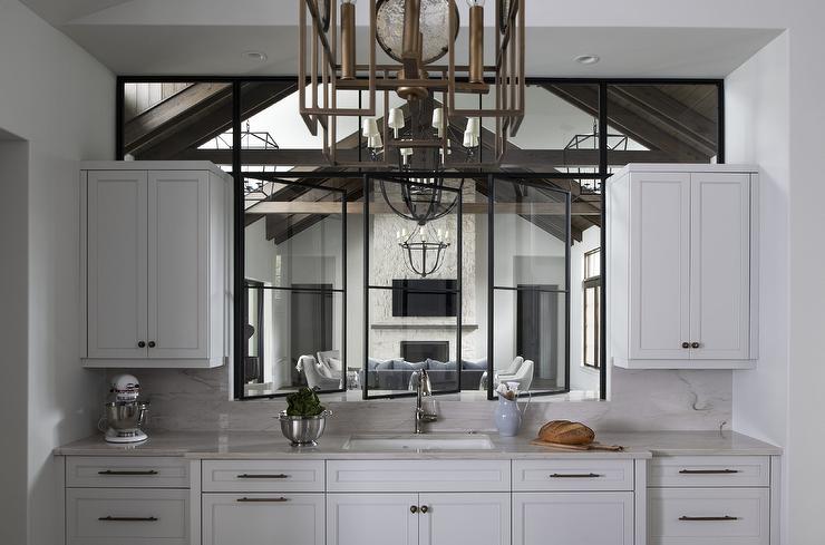 Bar area with oil rubbed bronze bar pulls. The cabinet features the Cosmas 305-192ORB Oil Rubbed Bronze Euro Style Bar Pull