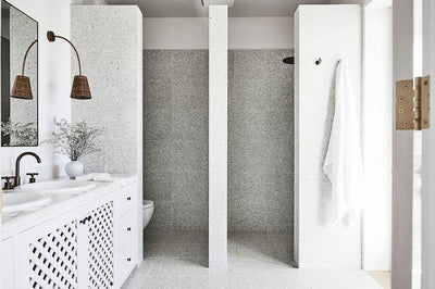 white bathroom featuring a white lattice cabinet door and the round Cosmas 5305ORB Oil Rubbed Bronze Round Cabinet Knob