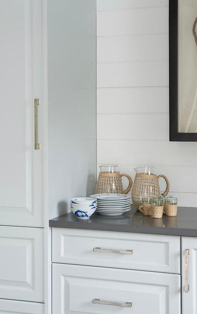 Kitchen hutch - white cabinets and drawers with black counter and the Cosmas Cosmas 702-160SN Satin Nickel Contemporary Cabinet Pulls