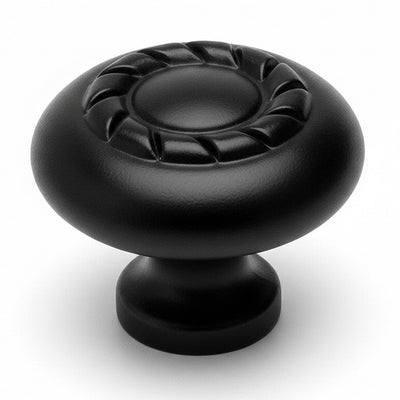 Round flat black cabinet knob with rope design on top and one and three eighteenths inch diameter