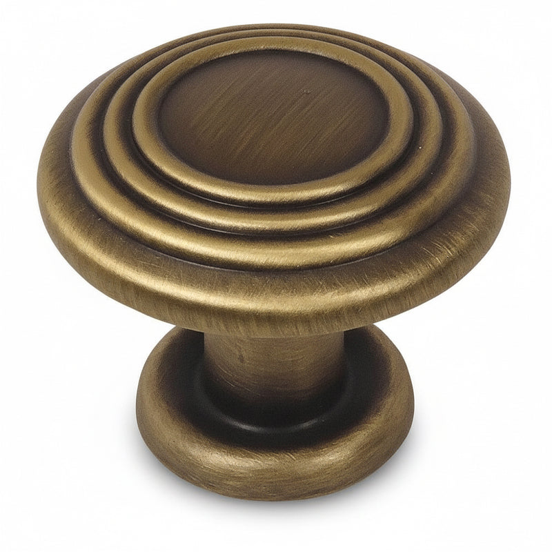 Brushed antique brass drawer knob with three raised rings on the face