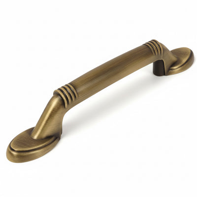 Brushed antique brass drawer pull with lines engraved on handle